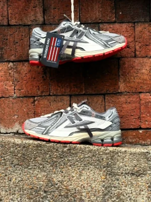 New Balance 1906 Protection Pack Grey Red